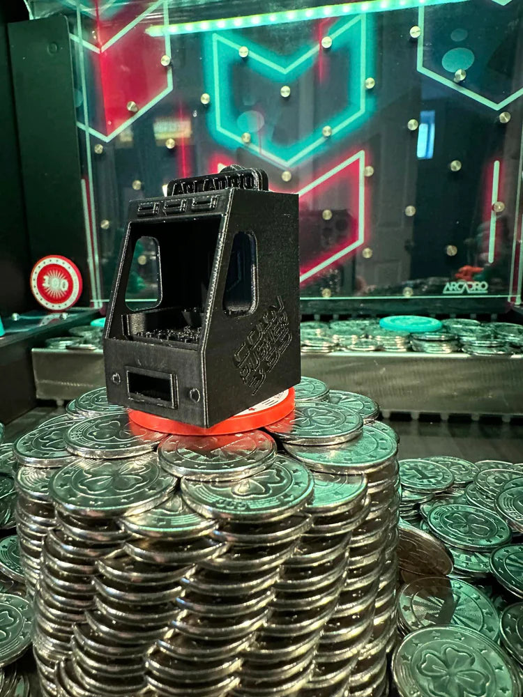 3d printed mini coin pusher on top of the coin tower