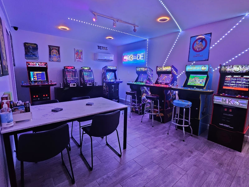 Arcade room with multiple video game machines and 2x Coin Pusher 365.