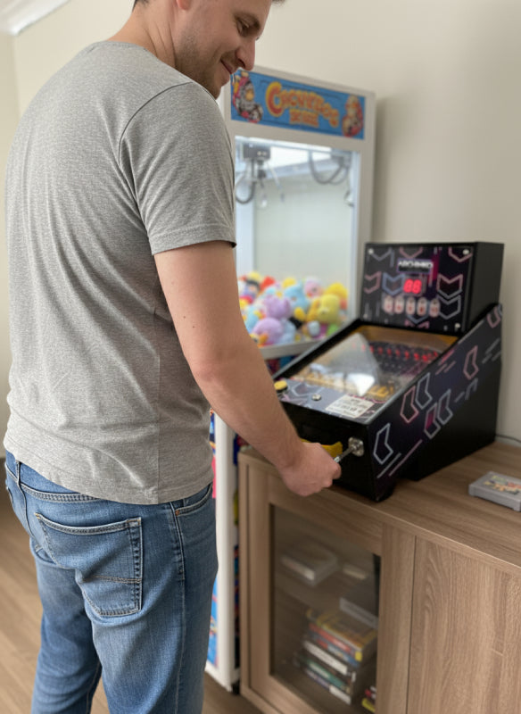 Man playing the Archinko machine